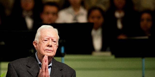 Former President Jimmy Carter teaches Sunday School class at Maranatha Baptist Church in his hometown Sunday, Aug. 23, 2015, in Plains, Ga. The 90-year-old Carter gave one lesson to about 300 people filling the small Baptist church that he and his wife, Rosalynn, attend. It was Carter's first lesson since detailing the intravenous drug doses and radiation treatment planned to treat melanoma found in his brain after surgery to remove a tumor from his liver. (AP Photo/David Goldman)