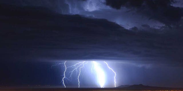Lightning strikes over Palmdale, Calif., early Tuesday Oct. 19, 2010 as a low pressure system brings unsettled wet weather to Southern California. (AP Photo/Mike Meadows)