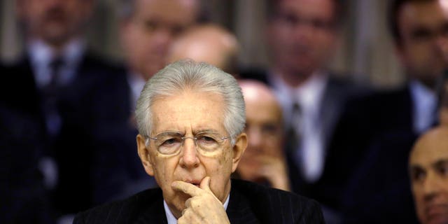 Italian Premier Mario Monti delivers his speech at the Foreign Ministry for the Italian Ambassadors conference in Rome, Friday, Dec. 21, 2012. Monti pledged to resign as soon as the budget law is passed after Silvio Berlusconi yanked support for his government, accelerating national elections now expected in February. The budget law was approved Friday afternoon. (AP Photo/Gregorio Borgia)