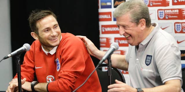 England manager Roy Hodgson, right, shares a laugh with player Frank Lampard during a news conference, Tuesday, June 3, 2014 in Miami Gardens, Fla. England plays matches at Sun Life Stadium, against Ecuador on Wednesday and Honduras on Saturday. (AP Photo/Wilfredo Lee)
