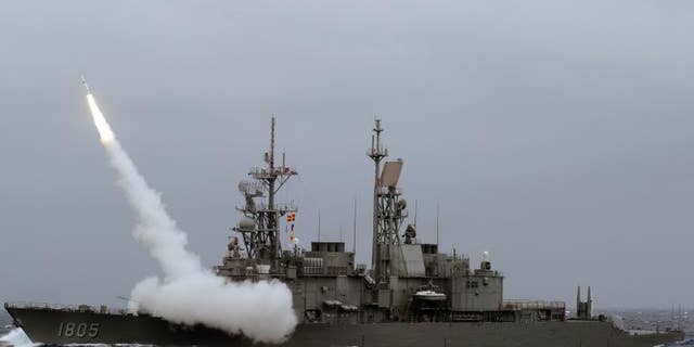 A Taiwan navy Kidd-class destoryer launches a SM-2 surface to air missile during a live fire drill at sea near the east coast of Taiwan on September 26, 2013