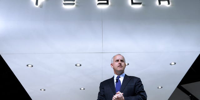 FILE - In this Jan. 14, 2014, photo, Diarmuid O'Connell, Tesla Vice President, Business Development speaks during media previews at the North American International Auto Show in Detroit. Tesla reports quarterly earnings on Wednesday, Feb. 19, 2014. (AP Photo/Paul Sancya, File)