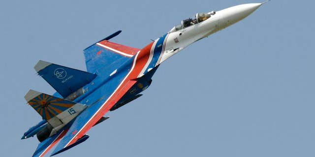 FILE- In this Saturday, May 26, 2007 file photo, a Sukhoi Su-27 fighter jet of the Russian air force elite aerobatic team Russkiye Vityazi (Russian Knights) makes a low pass during an air show in Rostov-on-Don, Russia. A pilot of the Russian air force's elite aerobatic squadron died Thursday, June 9, 2016 when his fighter jet crashed near Moscow. The Russian Defense Ministry said the Su-27 fighter jet went down while returning from a training mission. It said, according to preliminary information, the crash had been caused by a technical malfunction, but wouldn't elaborate pending an official probe. 3 ﻿(AP Photo/Sergei Venyavsky, file)