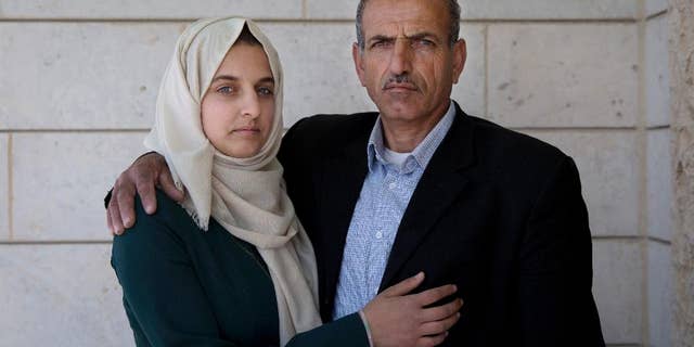 Ismail al-Wawi, 54, right and Ghayda al-Wawi, 17, the father and sister of the 12-year-old Palestinian girl imprisoned in the stabbing plot.