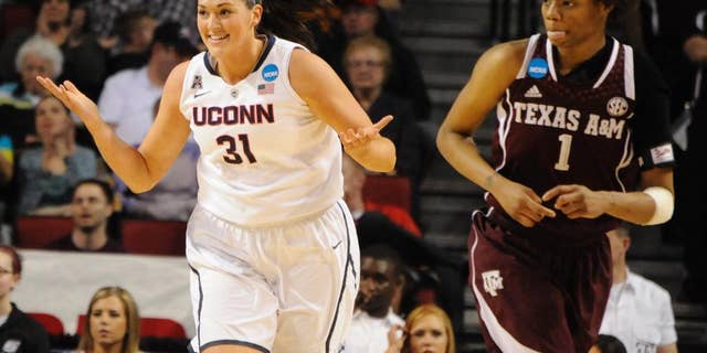 Connecticut's Stefanie Dolson (31) and Texas A&M's Courtney Williams (1) during the first half of their Monday March 31, 2014 regional final in the NCAA college basketball tournament in Lincoln, Neb.(AP Photo/Dave Weaver)