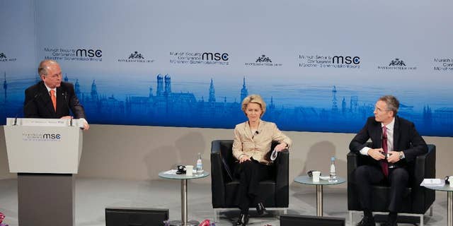 Munich Security Conference Chairman Wolfgang Ischinger, left, welcomes German Defense Minister Ursula von der Leyen, center,  and NATO Secretary General Jens Stoltenberg during his opening speech at the 51. Security Conference in Munich, Germany, Friday, Feb. 6, 2015. The conference on security policy takes place from Feb. 6, 2015  to Feb. 8, 2015. (AP Photo/Matthias Schrader)