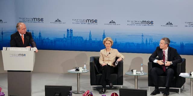 Munich Security Conference Chairman Wolfgang Ischinger, left, welcomes German Defense Minister Ursula von der Leyen, center, and NATO Secretary General Jens Stoltenberg during his opening speech at the 51. Security Conference in Munich, Germany, Friday, Feb. 6, 2015. The conference on security policy takes place from Feb. 6, 2015 to Feb. 8, 2015. (AP Photo/Matthias Schrader)