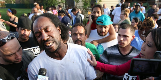 FILE - This May 6, 2013 file photo shows neighbor Charles Ramsey speaking to media near the home where missing women Amanda Berry, Gina DeJesus and Michele Knight were rescued in Cleveland. Ramsey, the man who famously put down his Big Mac to help rescue three women held captive for a decade in an Ohio house will never have to pay for another burger in his hometown. Ramsey has been promised free burgers for life at more than a dozen Cleveland-area restaurants. (AP Photo/The Plain Dealer, Scott Shaw, File)