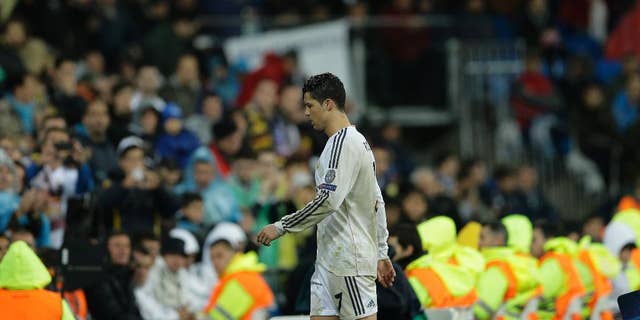Real's Cristiano Ronaldo leaves the game during a Champions League quarterfinal first leg soccer match between Real Madrid and Borussia Dortmund at the Santiago Bernabeu   stadium in Madrid, Spain, Wednesday April 2, 2014. (AP Photo/Paul White)