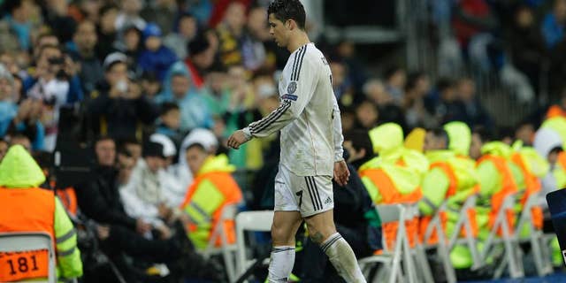 Real's Cristiano Ronaldo leaves the game during a Champions League quarterfinal first leg soccer match between Real Madrid and Borussia Dortmund at the Santiago Bernabeu stadium in Madrid, Spain, Wednesday April 2, 2014. (AP Photo/Paul White)