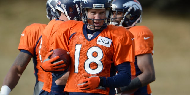 Denver Broncos quarterback Peyton Manning (18) runs through drills during the NFL football team's practice Tuesday, Jan. 8, 2013, in Englewood, Colo. The Broncos play the Baltimore Ravens at home on Saturday in a playoff game. (AP Photo/The Denver Post, John Leyba) MAGS OUT TV OUT