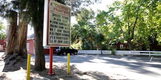 July 19: A welcome sign at the entrance to the Creative Frontiers preschool and elementary school is seen after California officials closed the private school amid accusations of child molestation, in Citrus Heights, Calif.