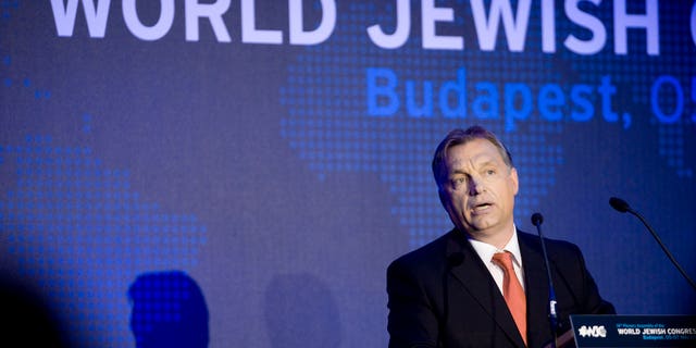Hungarian Prime Minister Viktor Orban delivers his speech during the opening dinner of the World Jewish Congress in Budapest, Hungary, Sunday, May 5, 2013. (AP Photo/MTI, Szilard Koszticsak)