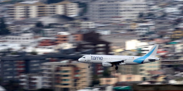 FILE - In this Jan. 22, 2013 file photo, an Ecuadorean Tame jetliner approaches the Mariscal Sucre airport, in Quito, Ecuador. The airline on Thursday, Jan. 23, 2014, suspended its daily flights to and from Venezuela until that country's cash-strapped government pays it $43 million owed for ticket sales. According to Venezuela's airlines association the Venezuelan government owes carriers several billion dollars due to its rigid currency controls. (AP Photo/Dolores Ochoa, File)