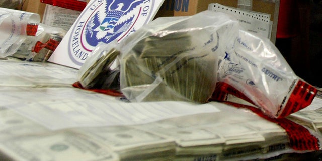 FILE: Nov. 2003: Cash seized in a federal investigation. (Reuters)