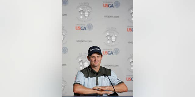 Justin Rose, of England, talks during a news conference for the U.S. Open golf tournament in Pinehurst, N.C., Tuesday, June 10, 2014. The tournament starts Thursday. (AP Photo/Eric Gay)