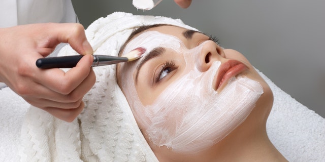 beauty salon series. facial mask applying