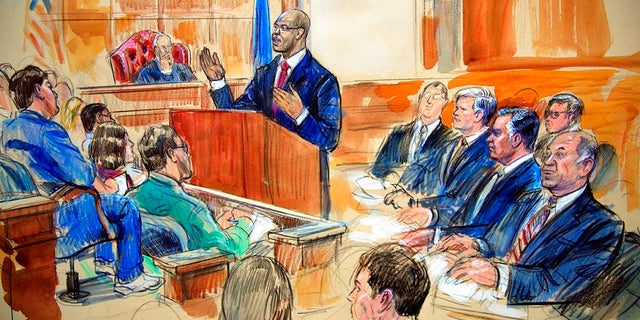 This courtroom sketch depicts Paul Manafort, seated right row second from right, together with his lawyers, the jury, seated left, and the U.S. District Court Judge T.S. Ellis III, back center, listening to Assistant U.S. Attorney Uzo Asonye, standing, during opening arguments in the trial of President Donald Trump's former campaign chairman Manafort's on tax evasion and bank fraud charges.