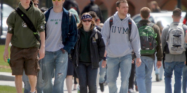Students walk across campus at the University of Vermont in Burlington, Vt. Over 43 million Americans have federal student debt, with almost a third owing less than $10,000 and more than half owing less than $20,000, according to the latest federal data.