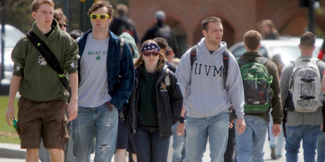 Students walk across campus at the University of Vermont in Burlington, Vermont. More than 43 million Americans have federal student debt, with almost a third owing less than $10,000 and more than half owing less than $20,000, according to the latest federal data.