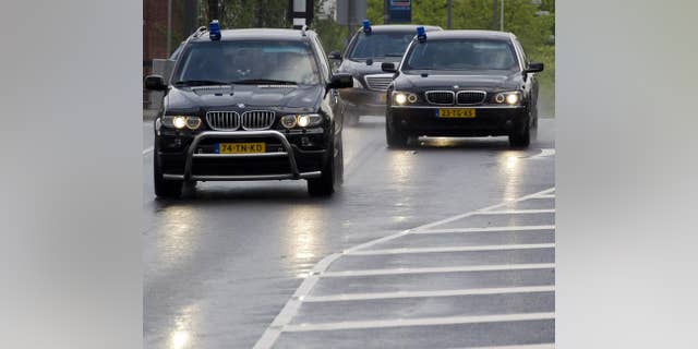 Police cars are seen in Amsterdam on June 23, 2011