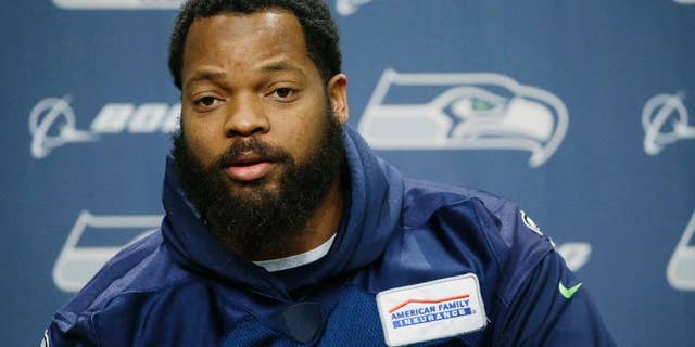 FILE -- In this Jan. 10, 2017 file photo, Seattle Seahawks defensive end Michael Bennett talks to reporters, in Renton, Wash. In a letter posted on Twitter Saturday, Feb. 11, 2017, the American professional football player pulled out of a planned trip to Israel, accusing its government of trying to use him for PR purposes. Bennett cited Muhammad Ali's support for the Palestinians, saying he too wanted to be a "voice for the voiceless." (AP Photo/Ted S. Warren, File)