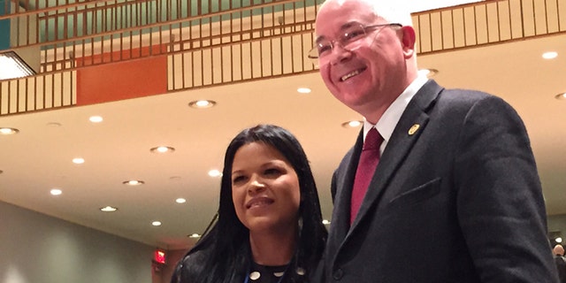 Maria Gabriela Chavez, the daughter of late Venezuelan leader Hugo Chavez, poses with Venezuela's ambassador to the United Nations, Rafael Ramirez, Wednesday, April 1, 2015 at United Nations headquarters. Chavez is Venezuela's deputy permanent representative to the United Nations. (AP Photo/Cara Anna)