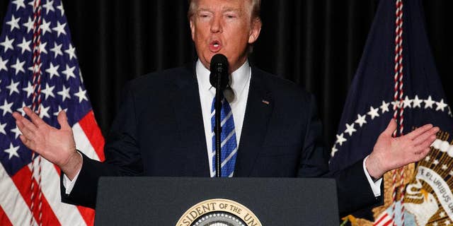 In this Feb. 8, 2017, photo, President Donald Trump speaks to the Major County Sheriffs' Association and Major Cities Chiefs Association, in Washington.Trump says it doesn’t take a lawyer to see that his order banning visitors from seven Muslim-majority nations is a “common sense” move to protect the U.S. from terrorists. He says even a bad high school student could figure that out. (AP Photo/Evan Vucci)