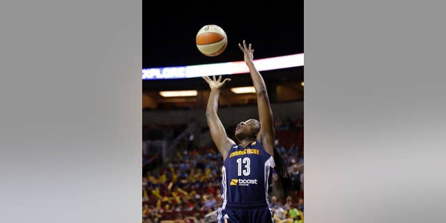 Connecticut Sun's Chiney Ogwumike grabs a rebound against the Seattle Storm during the first half of a WNBA basketball game Tuesday, July 15, 2014, in Seattle. (AP Photo/Elaine Thompson)