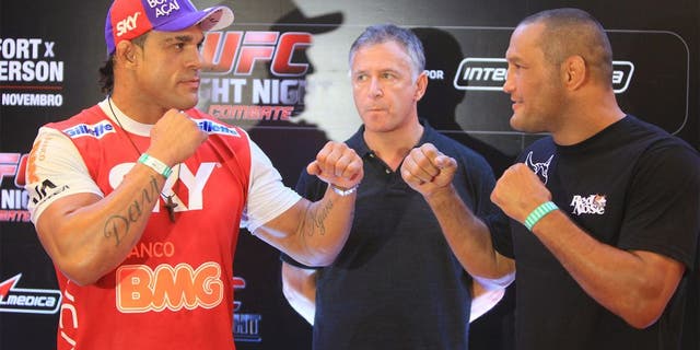 GOIANIA, BRAZIL - NOVEMBER 7: (L-R) Opponents Vitor Belfort and Dan Henderson face off during UFC Fight Night open workout at Buena Vista Shopping on November 7, 2013 in Goiania, Brazil. (Photo by Weimer Carvalho/Zuffa LLC/Zuffa LLC via Getty Images)