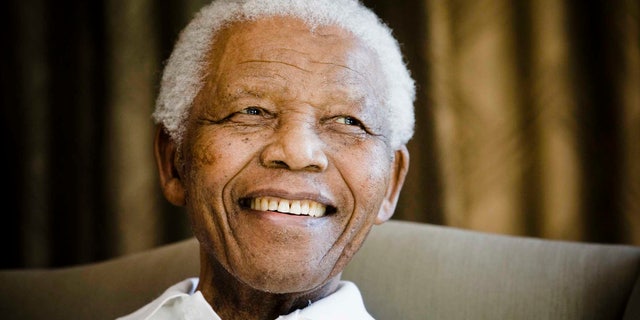 FILE - In this Tuesday, June 2, 2009 file photo, former South African President Nelson Mandela reacts at the Mandela foundation, in Johannesburg, South Africa, during a meeting with a group of American and South African students as part of a series of activities leading to Mandela Day on July 18th. Israel's state archive has published a 50-year-old letter stating that the Mossad spy service unwittingly offered paramilitary training to a young Nelson Mandela in 1962, and released a number of other documents showing a tense relationship between the Jewish state and apartheid-era South Africa. The release of the documents in the wake of Mandela’s death appear to be aimed at blunting criticism of Israel's close alliance with South Africa's apartheid rulers. (AP Photo/Theana Calitz-Bilt, Pool, File)