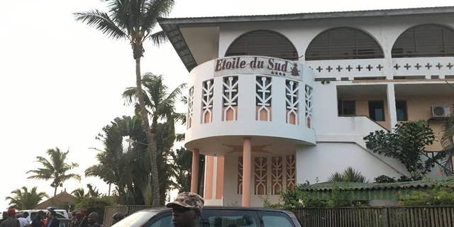 A soldier stands outside the Etoile du Sud, where gunmen attacked earlier in March.