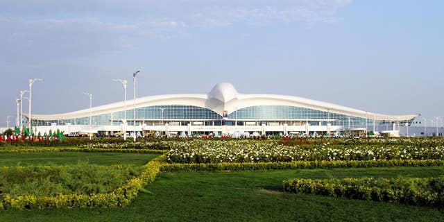 A view of the new international airport terminal outside Ashgabat, Turkmenistan, Saturday, Sept. 17, 2016. The capital of Turkmenistan, a country largely closed to outsiders, has opened a $2.3-billion terminal at its international airport in the shape of a flying falcon. The terminal, whose roof in profile resembles a bird with spread wings, adds to Ashgabat's vast array of gleaming, idiosyncratic buildings. (AP Photo)