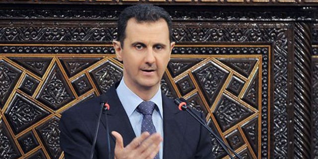 June 3, 2012: In a much-anticipated speech, embattled Syrian president Bashar al-Assad blames foreign powers and "terrorists" for the violence that has wracked the country for the last 15 months. (AP)