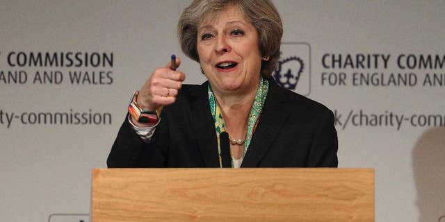 Britain's Prime Minister Theresa May speaks to members of the Charity Commission for England and Wales at The Royal Society in London, where she detailed plans to provide greater support for those suffering mental health problems, Monday Jan. 9, 2017. (Dan Kitwood/Pool via AP)