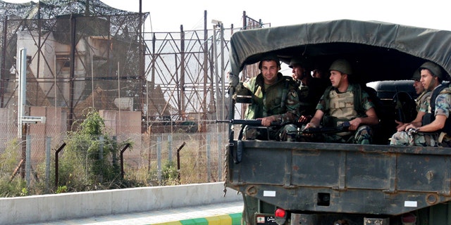 June 5: Lebanese army soldiers sit on their truck as they patrol the Lebanese-Israeli border near the village of Kfar Kila, south Lebanon.