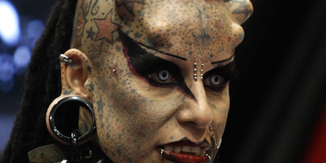 Mexican tattoo artist Maria Jose Cristerna, known as 'Mujer Vampiro' (Vampire Woman), attends a photo opportunity during the "Expo Tatuaje" international tattoo expo in Monterrey April 3, 2011.