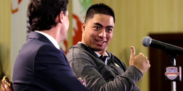 Notre Dame inside linebacker Manti Te'o, right, jokes with assistant head coach/defensive coordinator Bob Diaco before a news conference, Thursday, Jan. 3, 2013 in Fort Lauderdale, Fla. Notre Dame will play Alabama on Jan. 7 in the NCAA college football BCS Championship game. (AP Photo/Wilfredo Lee)
