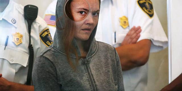 FILE - In this Sept. 21, 2015 file photo, Rachelle Bond is arraigned on charges of acting after the fact in helping to dispose of the body of her daughter, dubbed Baby Doe, after her boyfriend allegedly killed the girl, in Dorchester District Court, in Boston. A Suffolk Superior Court judge on Thursday, Dec. 1, 2016, scheduled Bond’s trial for Feb. 22 in Boston. (Pat Greenhouse/The Boston Globe via AP, Pool)