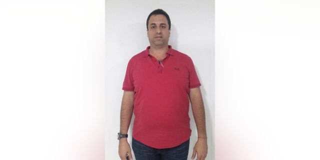 This photo released by Colombia's National Police shows Panama businessman Nidal Waked after he was arrested at the international airport in Bogota, Colombia, Wednesday, May 4, 2016. Waked is sought by the United States and accused of being a leader of an organization that laundered drug profits through a web of companies including a luxury mall, a bank and the duty-free zone at Panama City's international airport. (Colombia National Police via AP)