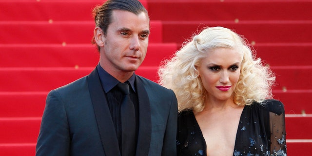Singer Gwen Stefani (R) and her husband musician Gavin Rossdale.