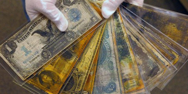Aug 15, 2008: Currency, part of the artifacts collection of the Titanic, is shown at a warehouse in Atlanta.