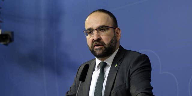 FILE - In this April 18, 2016 file photo, Sweden's Housing Minister Mehmet Kaplan appears before the media to confirm his resignation in Stockholm, Sweden. One refused to shake hands with a female journalist. Another compared Israel to Nazi Germany. A third was seen doing hand signs associated with Egypt’s Muslim Brotherhood in the background of a live TV broadcast. The behavior of some Muslim members of Sweden’s Green Party, which is part of a coalition government since 2014, has sparked concerns that the small environmentalist group may have been infiltrated by Islamists.  It also has triggered a wider discussion about whether Sweden has tried so hard to be inclusive and tolerant toward migrants that it's failed to stand up for its own feminist ideals.(Jessica Gow / TT via AP, File) SWEDEN OUT