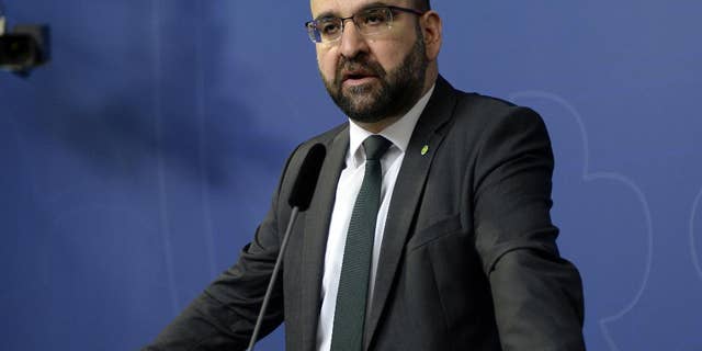 FILE - In this April 18, 2016 file photo, Sweden's Housing Minister Mehmet Kaplan appears before the media to confirm his resignation in Stockholm, Sweden. One refused to shake hands with a female journalist. Another compared Israel to Nazi Germany. A third was seen doing hand signs associated with Egypt’s Muslim Brotherhood in the background of a live TV broadcast. The behavior of some Muslim members of Sweden’s Green Party, which is part of a coalition government since 2014, has sparked concerns that the small environmentalist group may have been infiltrated by Islamists. It also has triggered a wider discussion about whether Sweden has tried so hard to be inclusive and tolerant toward migrants that it's failed to stand up for its own feminist ideals.(Jessica Gow / TT via AP, File) SWEDEN OUT