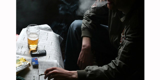 BRISTOL, UNITED KINGDOM - JUNE 30: Smokers drink and read newspapers in a public house on June 30, 2007 in Bristol England. From 6am on July 1 smoking in all enclosed places such as cafes and pubs will be banned in England. (Photo by Matt Cardy/Getty Images)