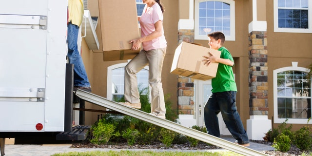 Family Loading Moving Truck