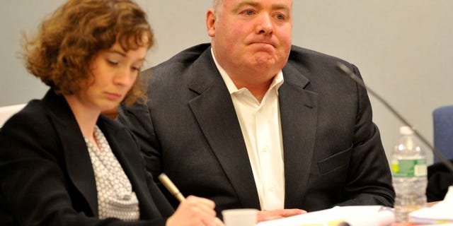 Michael Skakel, right, listens to testimony from his former defense attorney Mickey Sherman at Skakel's habeas corpus hearing at Rockville Superior Court in Vernon, Conn., on Tuesday, April 16, 2013. Skakel’s latest appeal trial began Tuesday with his former lawyer defending an accusation that he failed to competently defend Skakel when he was convicted of murder in 2002. (AP Photo/The Stamford Advocate, Jason Rearick, Pool)