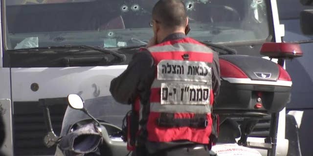 This frame grab from video, shows an Israeli emergency services personnel at scene of a truck-ramming attack in Jerusalem that killed at least four people and wounded several others in Jerusalem, Sunday, Jan. 8, 2017. Israeli police and rescue services said a Palestinian rammed his truck into a group of Israeli soldiers in one of the deadliest attacks of a more than yearlong campaign of violence. Security camera footage shows the truck barreling at a high speed off the road and into the crowd of people in the Armon Hanatziv neighborhood. (AP Photo)