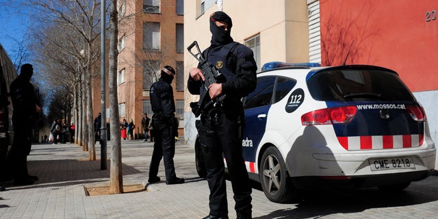 Regional police officers during a raid against jihad activity in Sabadell, near Barcelona, Wednesday, April 8, 2015.