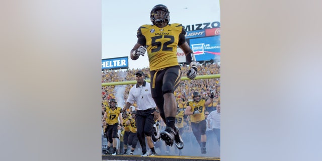 FILE - In this Sept. 8, 2012 file photo, Missouri's Michael Sam (52) runs onto the field along with their teammates before the start of an NCAA college football game against Georgia in Columbia, Mo. Michael Sam hopes his ability is all that matters, not his sexual orientation. Missouri's All-America defensive end came out to the entire country Sunday night, Feb. 9, 2014, and could become the first openly gay player in America's most popular sport. (AP Photo/Jeff Roberson, File)